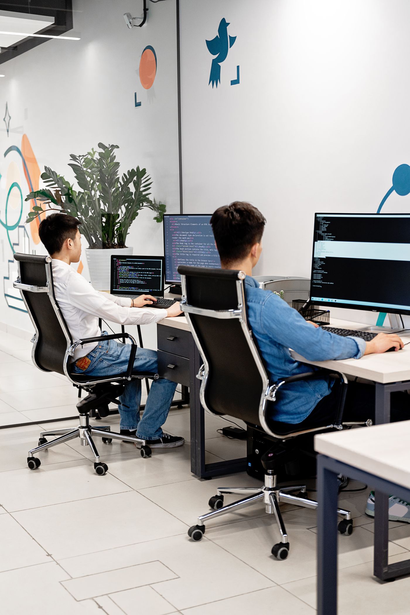 Senior Vigil engineers collaborating in a bright modern office